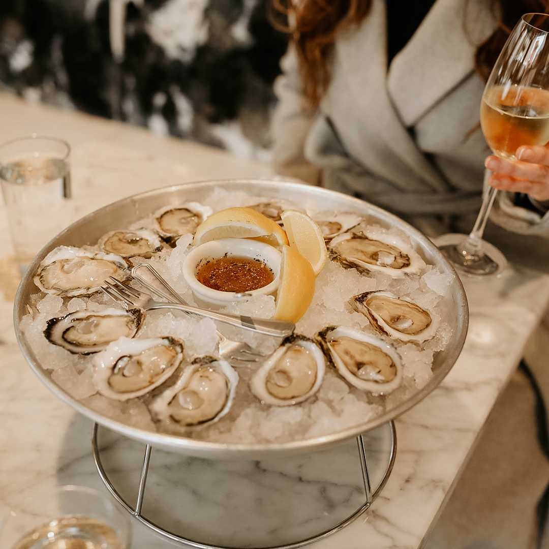 A photo of oysters being served at a restaurant. Photo is from our chattanooga photography marketing package.